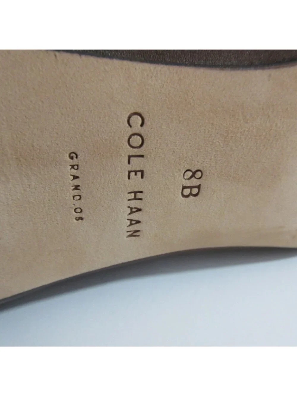 Cole Haan boots shown
